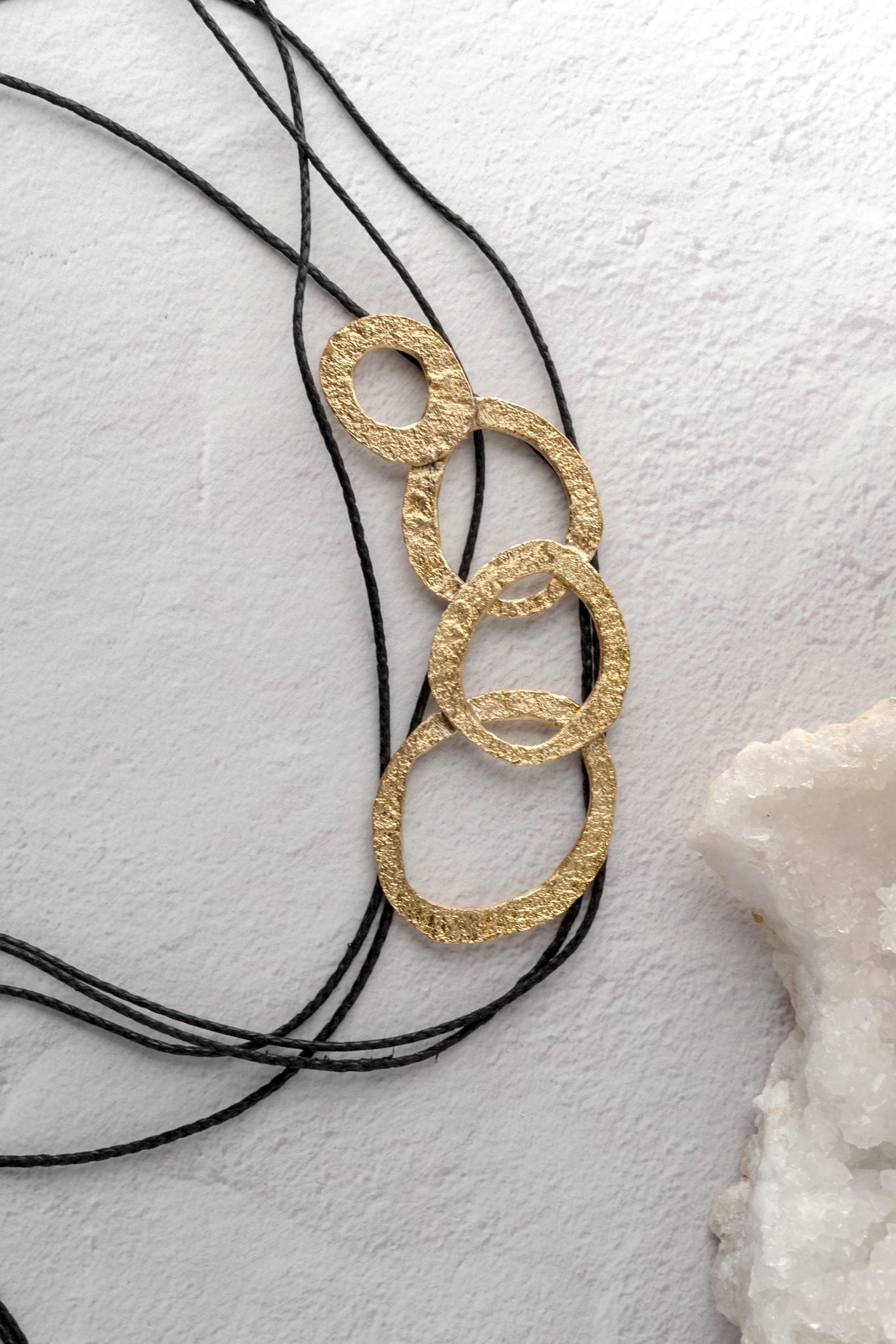 Kalliope Bronze Circle and Black Cord Necklace 