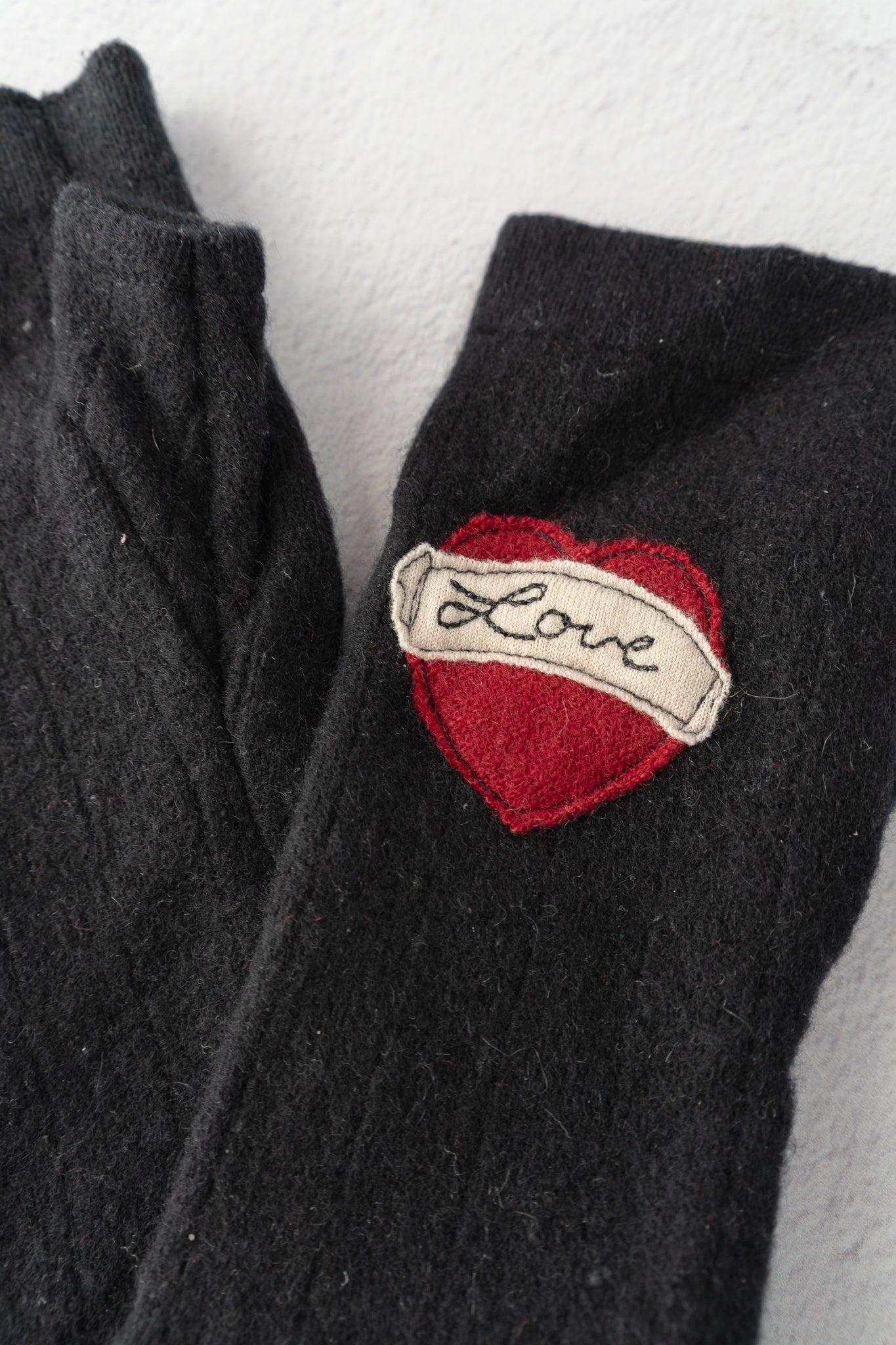Sardine Recycled Cashmere Handwarmers, Tattoo Heart F*ck, Black/Red 